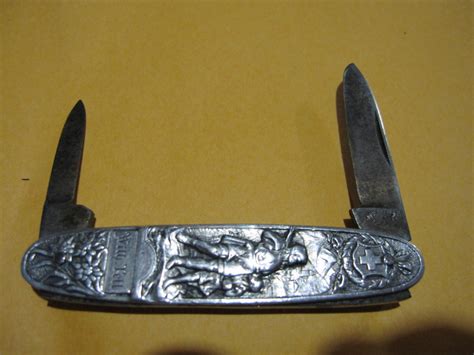 v antiques small metal box with helvetiorum riddle ac virtuti|Helvetiorum Fidei AC virtuti pocket knife .